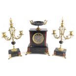 A 19thC black slate and red marble clock garniture, comprising mantel clock, the 10cm diameter Roman