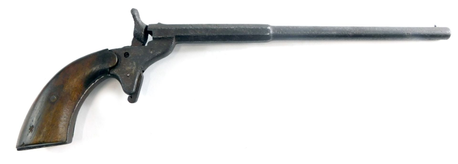 A German pub or beer hall pistol, with long barrel, approx. 6mm, with shaped wooden handle, probably
