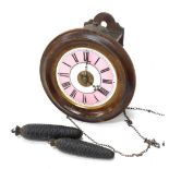 A 19thC Continental walnut alarm wall clock, with 18cm diameter enamel Roman numeric dial in pink an