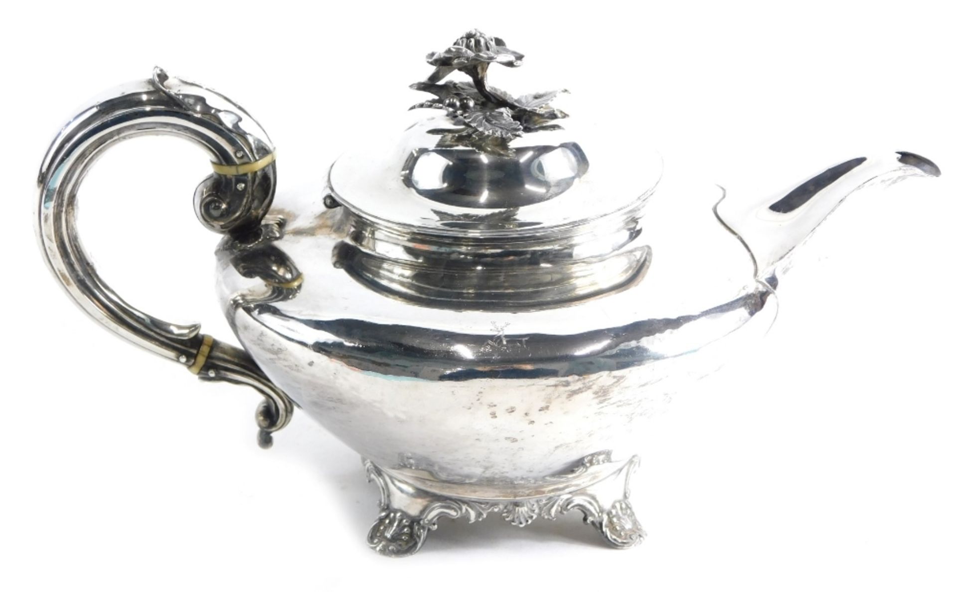 A George IV silver teapot, by Charles Fox II, with floral knop, acanthus leaf S scroll handle, circu