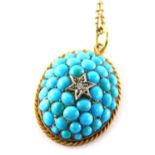 An Edwardian oval turquoise pendant, of raised design with central diamond and star setting, surroun