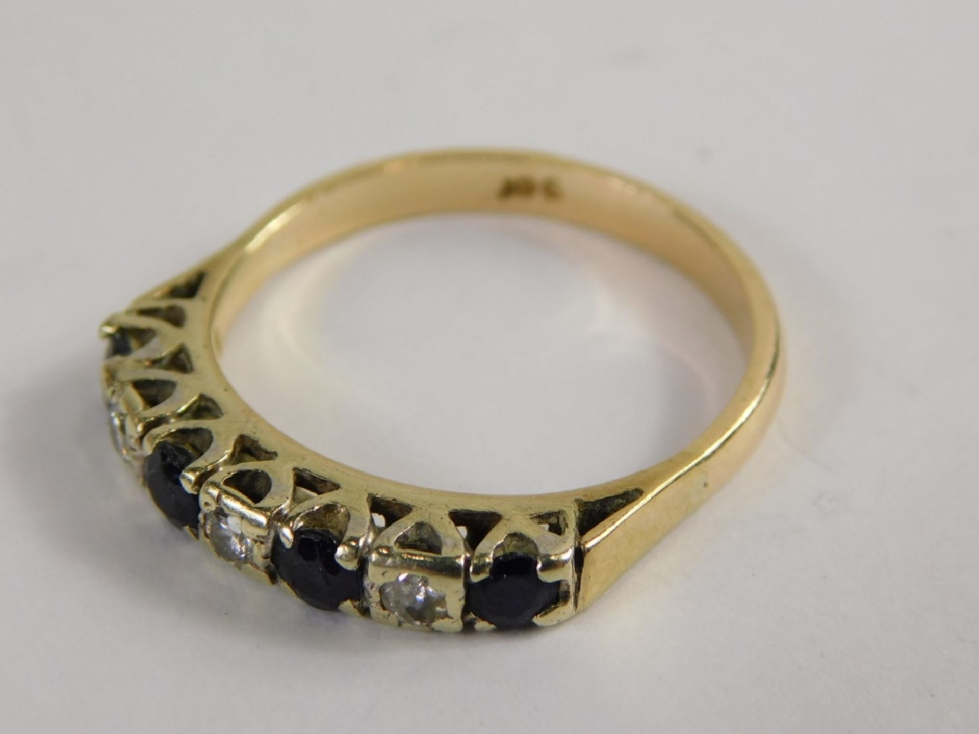 An 18ct gold sapphire and diamond half hoop dress ring, set with five round brilliant cut sapphires, - Image 4 of 4