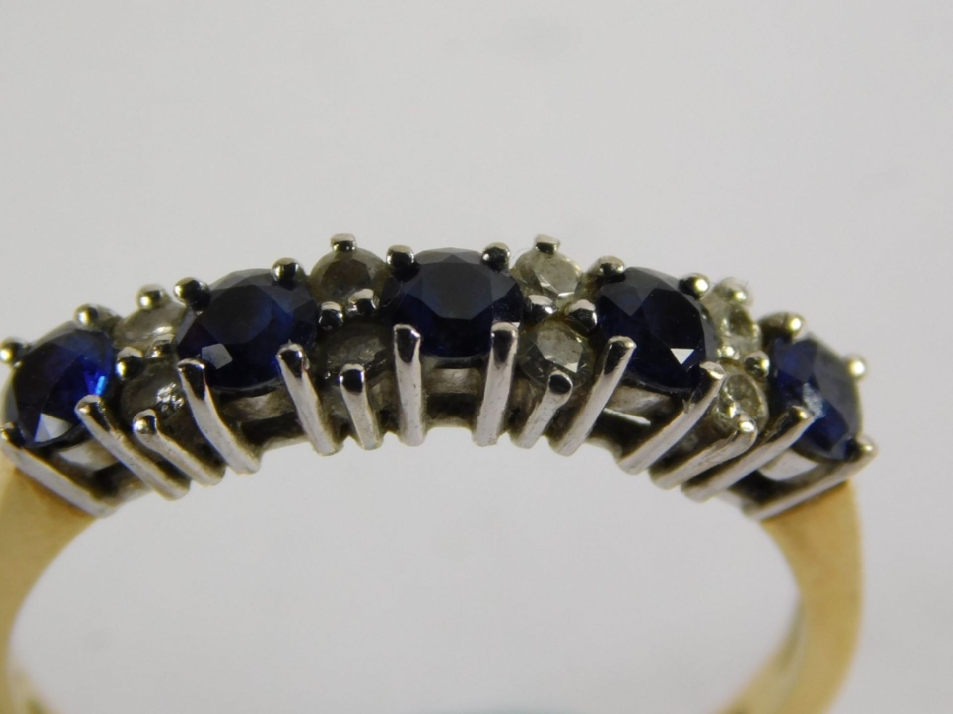 An 18ct gold sapphire and diamond half hoop dress ring, set with five round brilliant cut sapphires, - Image 2 of 4