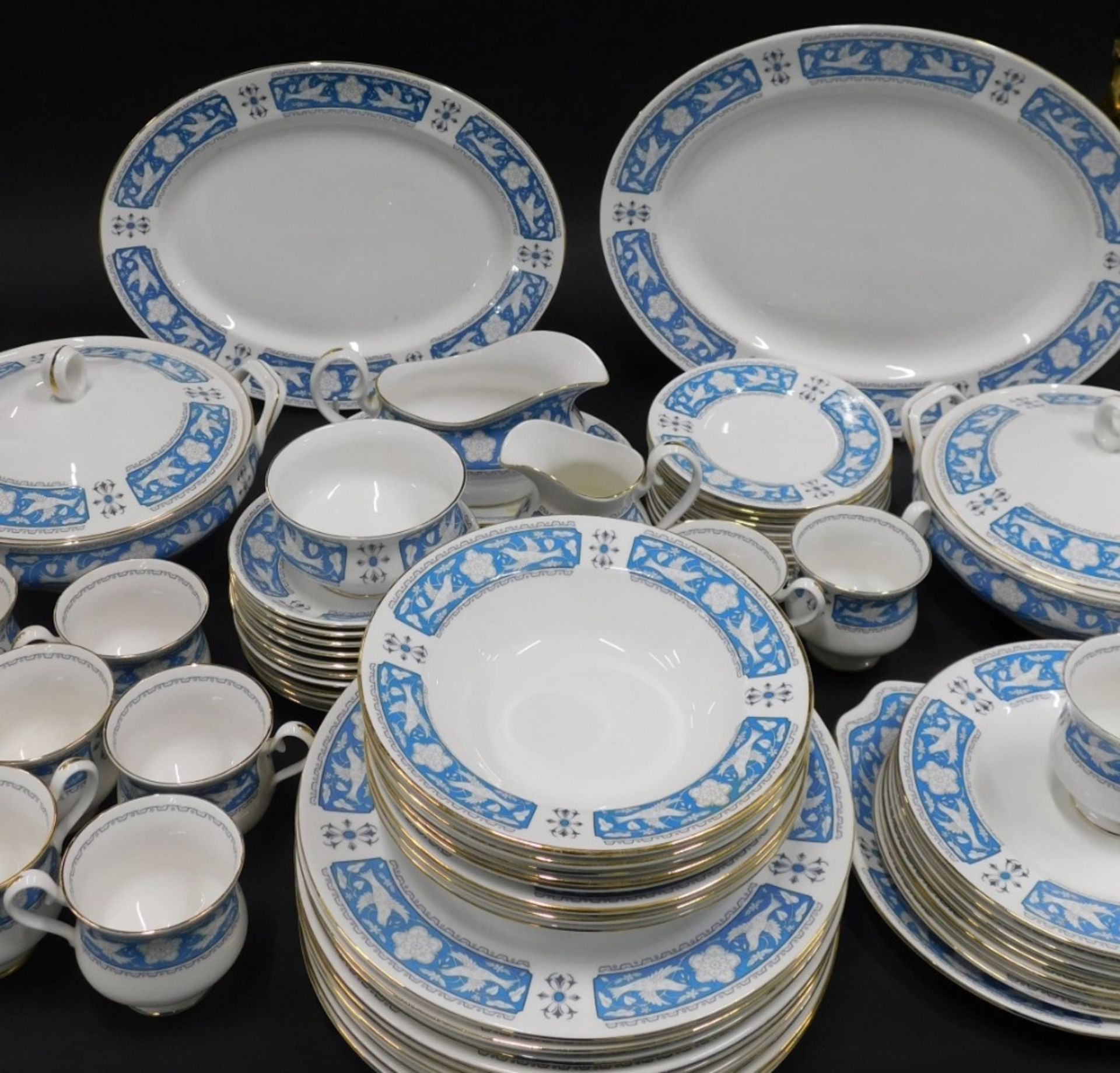 A comprehensive Royal Albert Tudor Rose pattern part dinner service, to include a pair of lidded tur