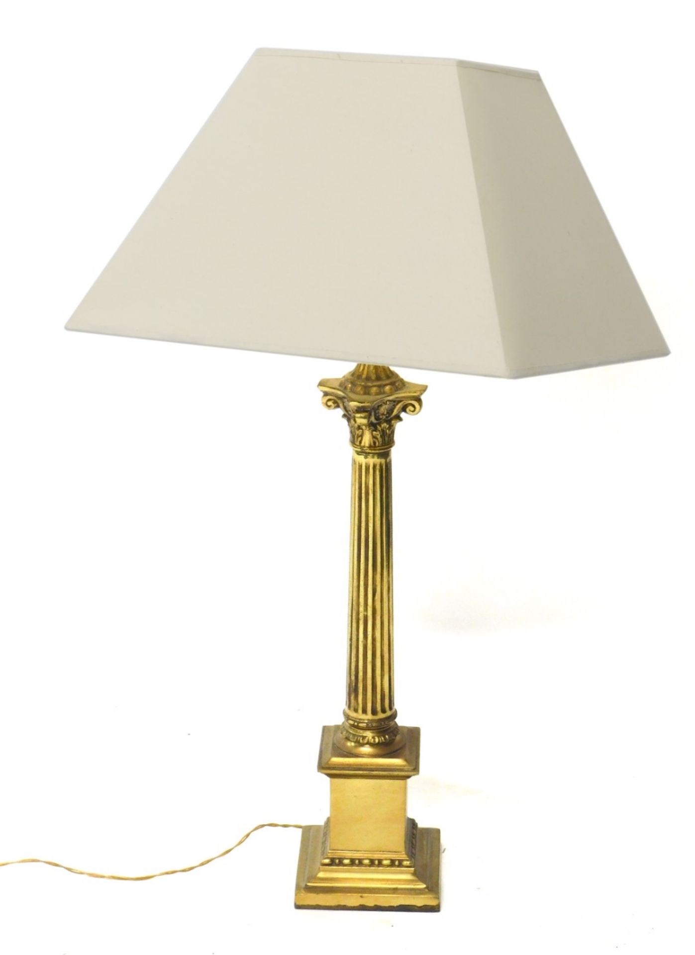 A brass table lamp, with classical column, on stepped base with modern electric fitting and cream s