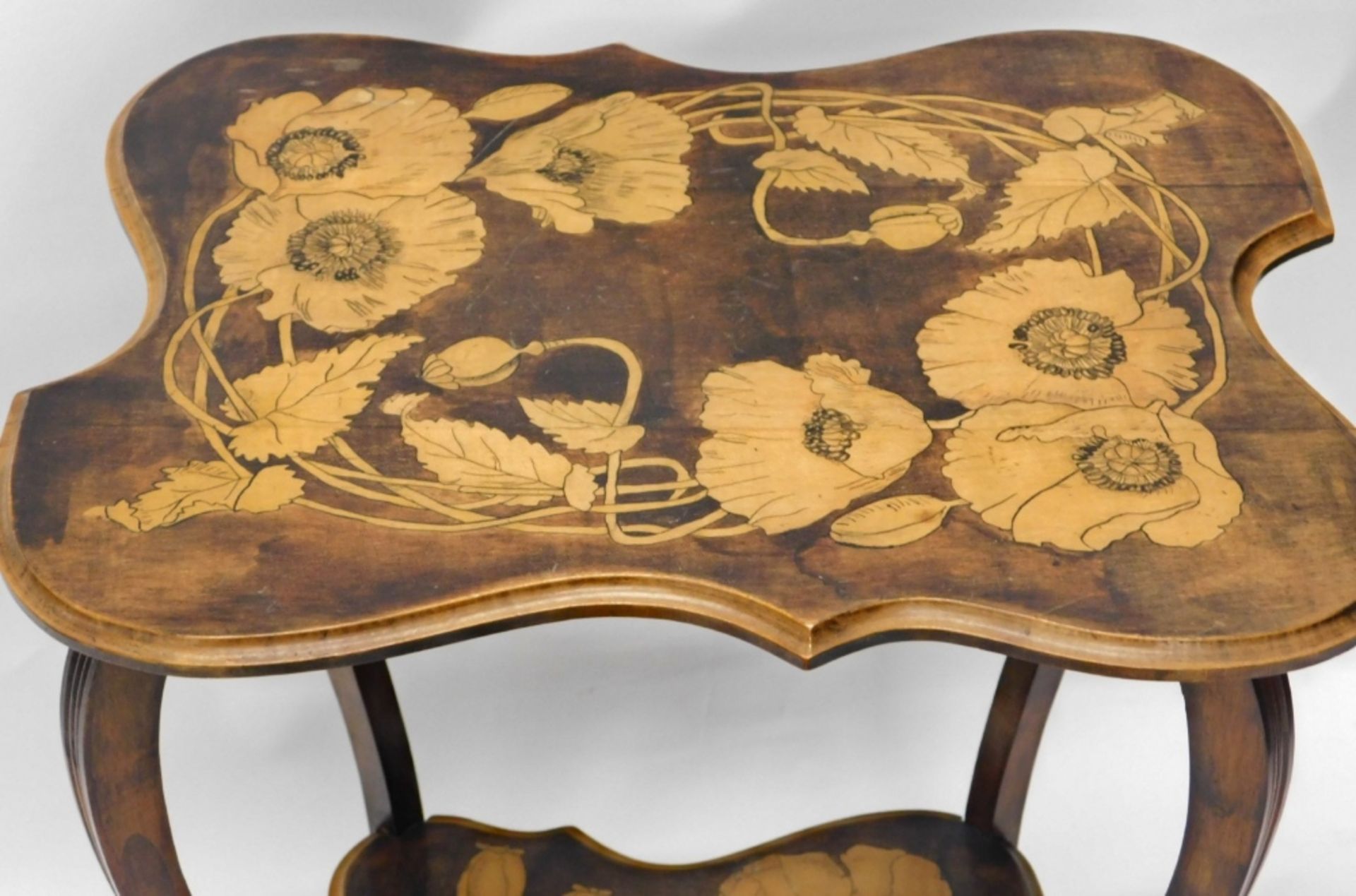 An early 20thC Arts and Crafts pokerwork occasional table, the shaped top decorated with flower hea - Image 2 of 3