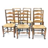 A set of eight 19thC Lancashire ash and elm ladder back chars, each with rope seats on turned legs,