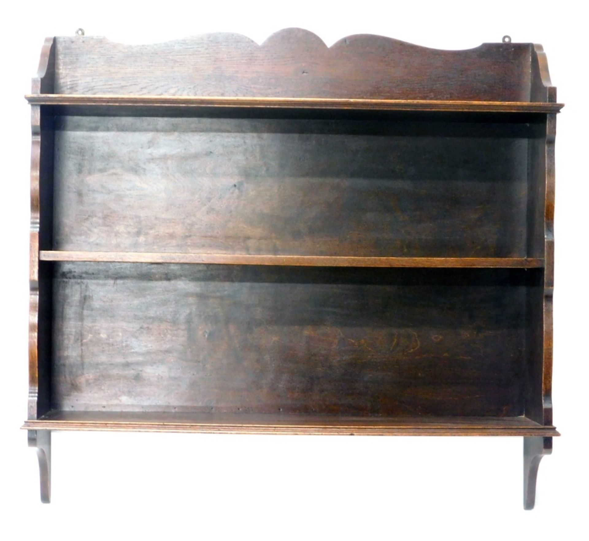 An oak hanging bookshelf, with three part galleried back, 84cm high, 89cm wide, 20cm deep.