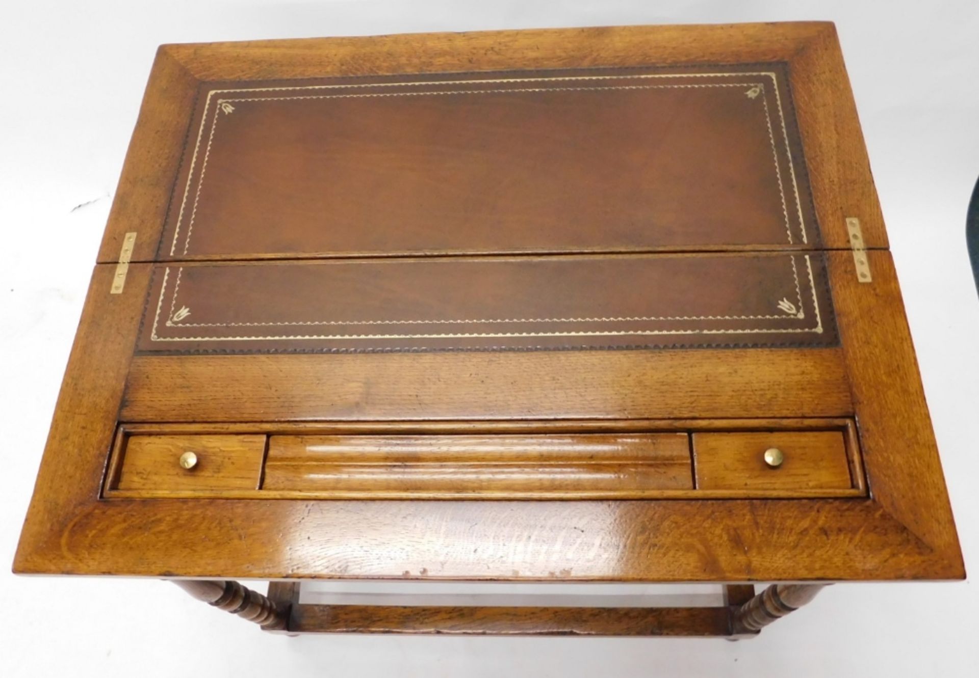 A 20thC oak fold over desk, with a brown leather tooled section with another section for ink bottles - Image 2 of 3