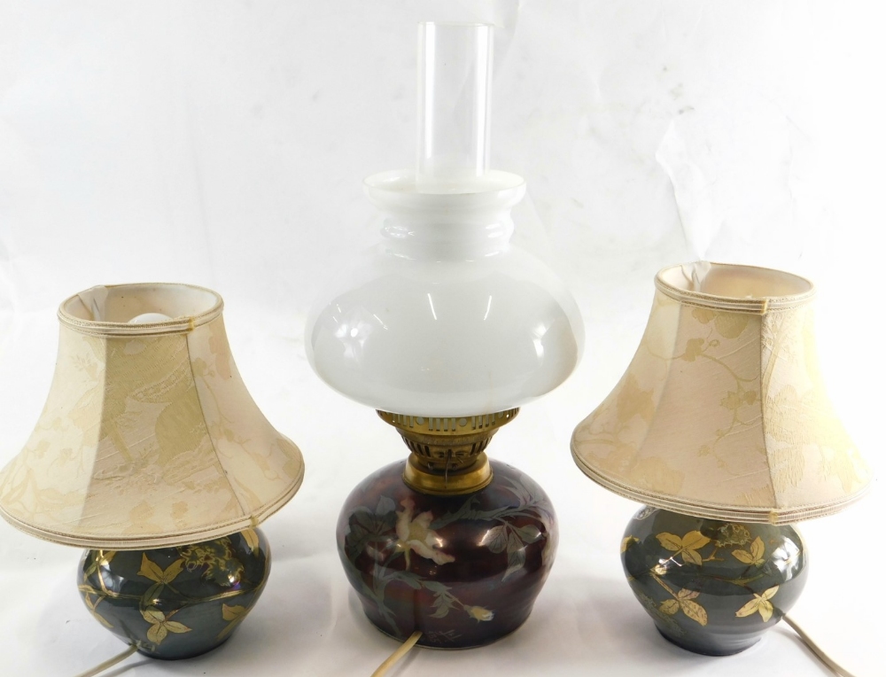 Three Jonathan Chiswell Jones studio pottery lustre lamps, comprising a pair of table lamps in gr