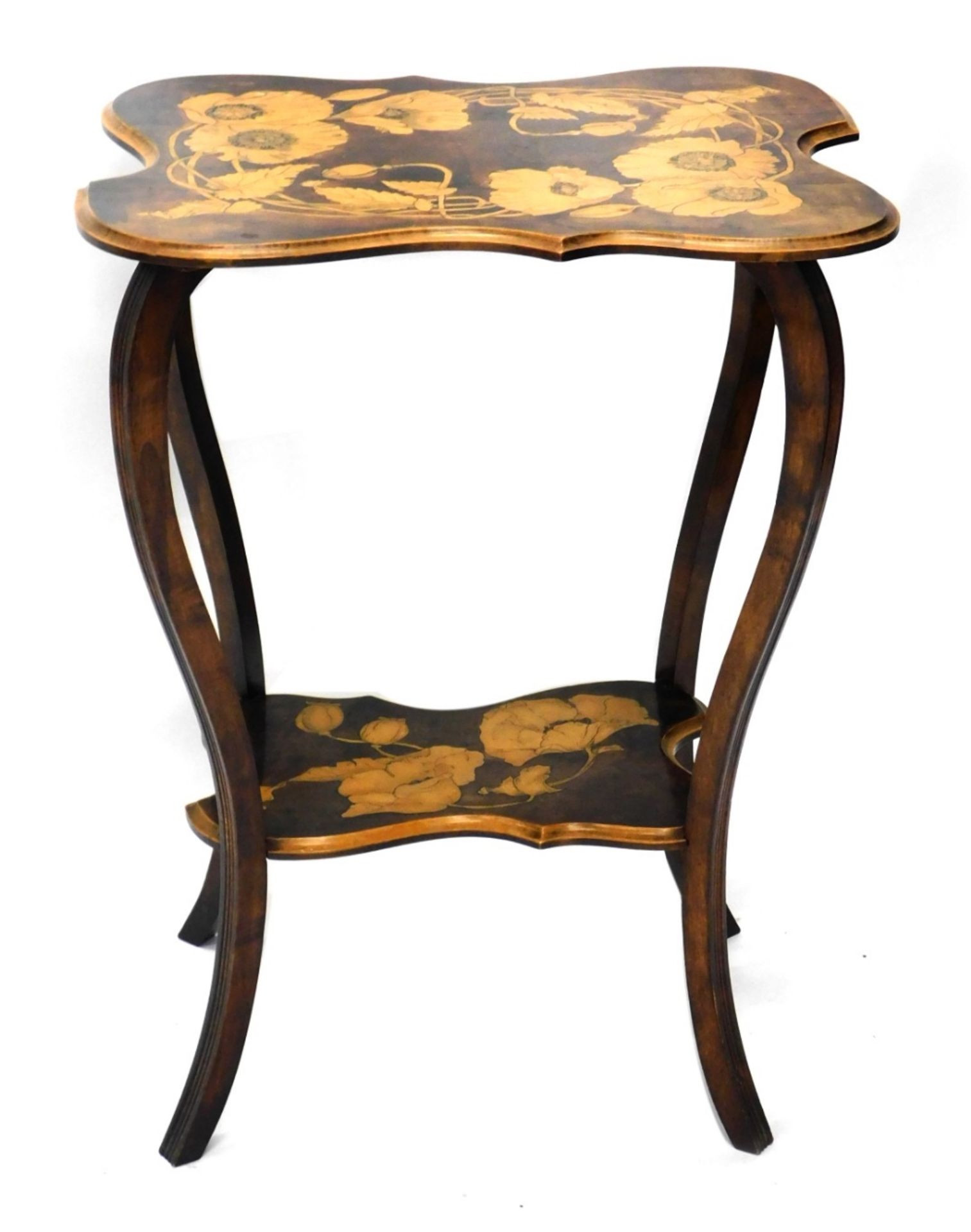 An early 20thC Arts and Crafts pokerwork occasional table, the shaped top decorated with flower hea