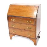 An Edwardian mahogany and boxwood strung bureau, the fall revealing a fitted interior, above three l