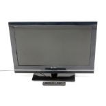 A Sony Bravia KDL-32V5500 32" television, in black, with wire and remote control.