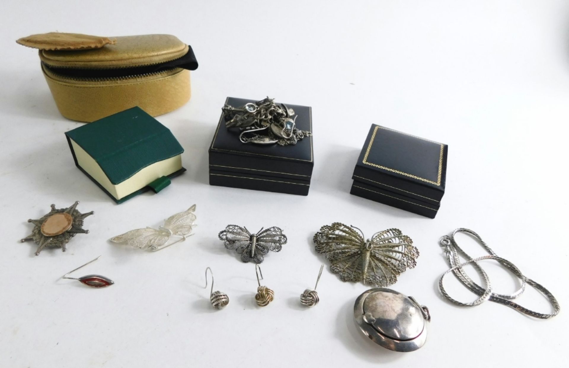 A group of silver and other costume jewellery, comprising a silver locket pendant, silver filigree b