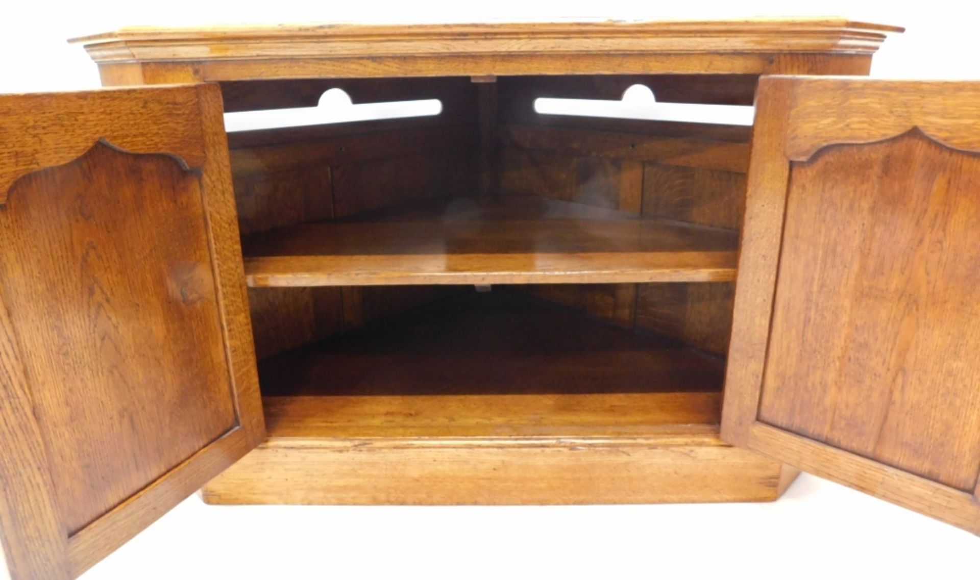 An oak Titchmarsh & Goodwin style corner hi-fi stand, of triangular form with pierced back and doubl - Image 2 of 2