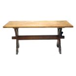 A 20thC oak refectory table, on shaped legs joined by heavy stretcher, 78cm high, 166cm wide, 85cm d