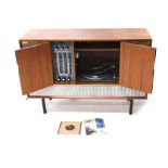 A Decca walnut cased radiogram, with Garrard turntable, 31cm wide, and Decca system, on turned legs,