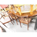 A mahogany finish Regency style dining suite, comprising D end dining table and four chairs and two