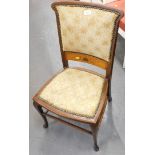 A 19thC mahogany and inlaid occasional chair, with studded overstuffed back and seat, on cabriole le