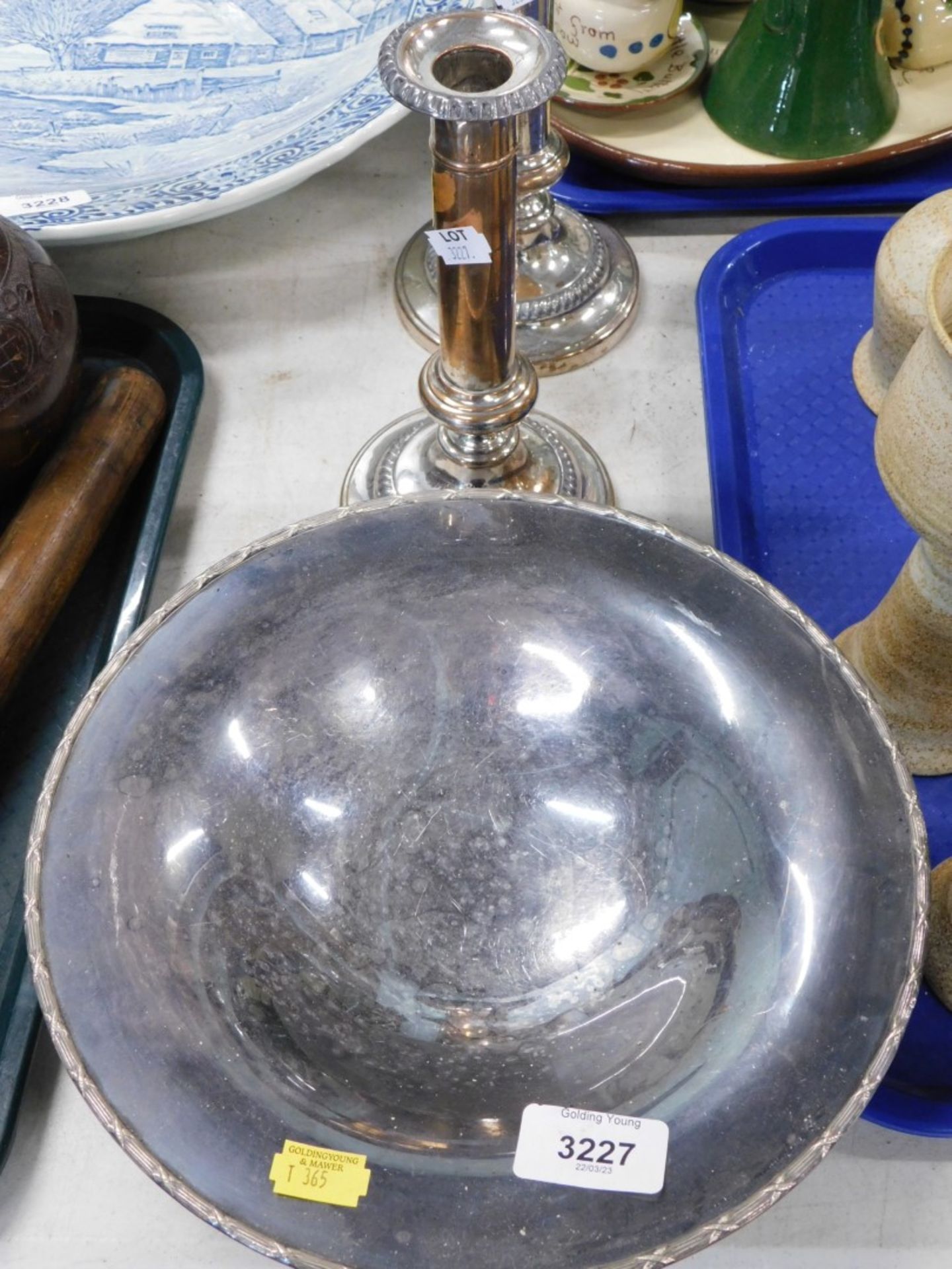 A pair of silver plated candlesticks, and a circular comport.