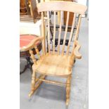 An ash and elm grandfather style rocking chair.