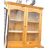 A pine side cabinet, with glazed front.