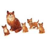 Five Beswick pottery figures modelled as ginger cats, and kittens, the largest 21cm high.