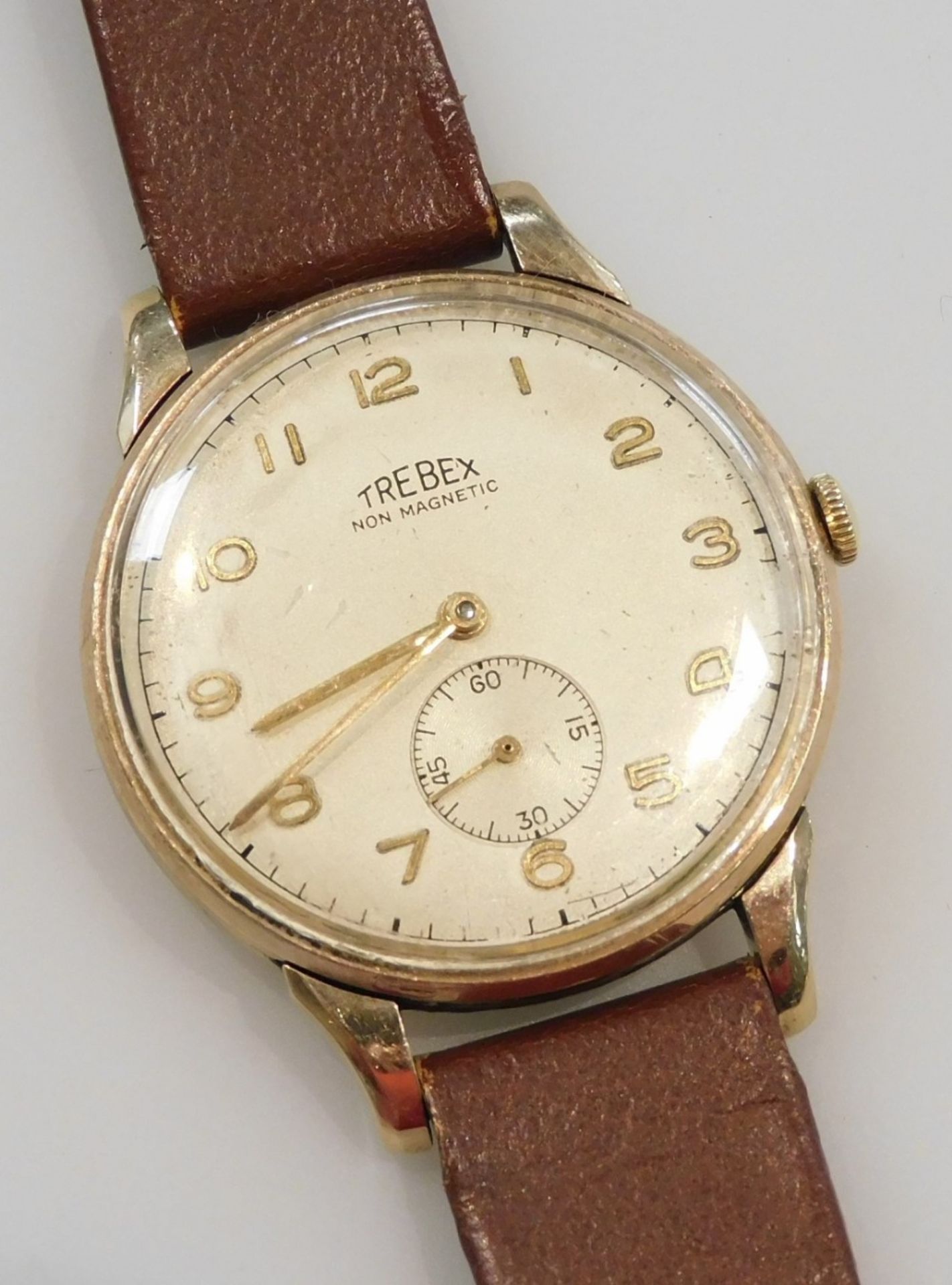 A Trebex gentleman's 9ct gold cased wristwatch, circular champagne dial bearing Arabic numerals, sub