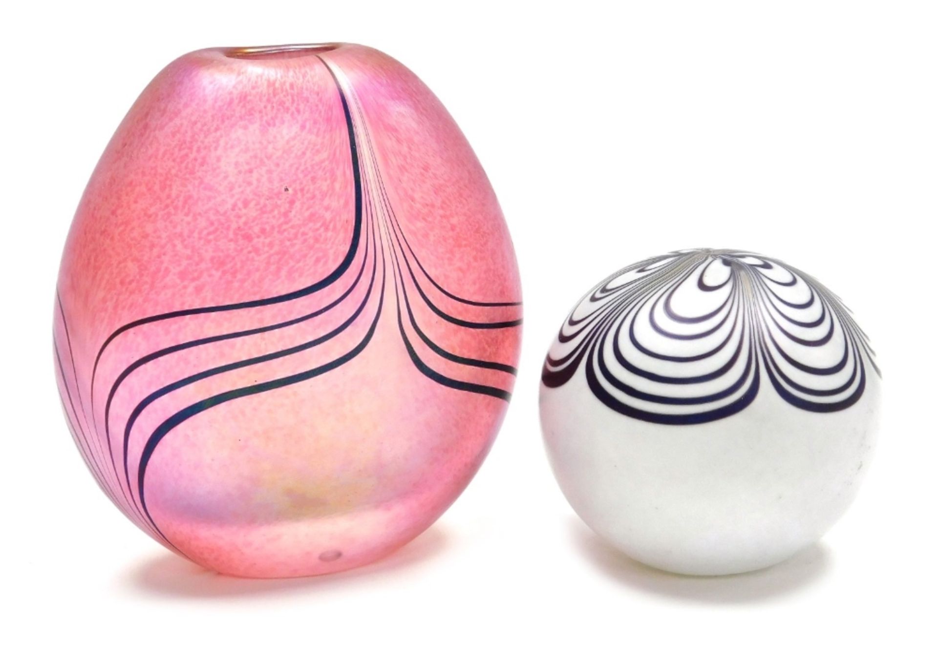 Two pieces of Glasform glass, comprising a paperweight with purple petal decoration against a white