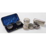 A group of small silver, to include a pair of Victorian silver open salts, embossed with flowers on