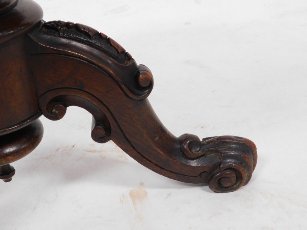 A Victorian mahogany piano stool, the circular revolving top raised on a scroll and leaf carved colu - Image 3 of 3