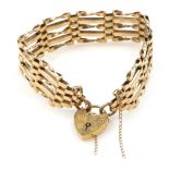 A 9ct gold five bar gate bracelet, on a heart shaped padlock clasp, with safety chain as fitted, 17.