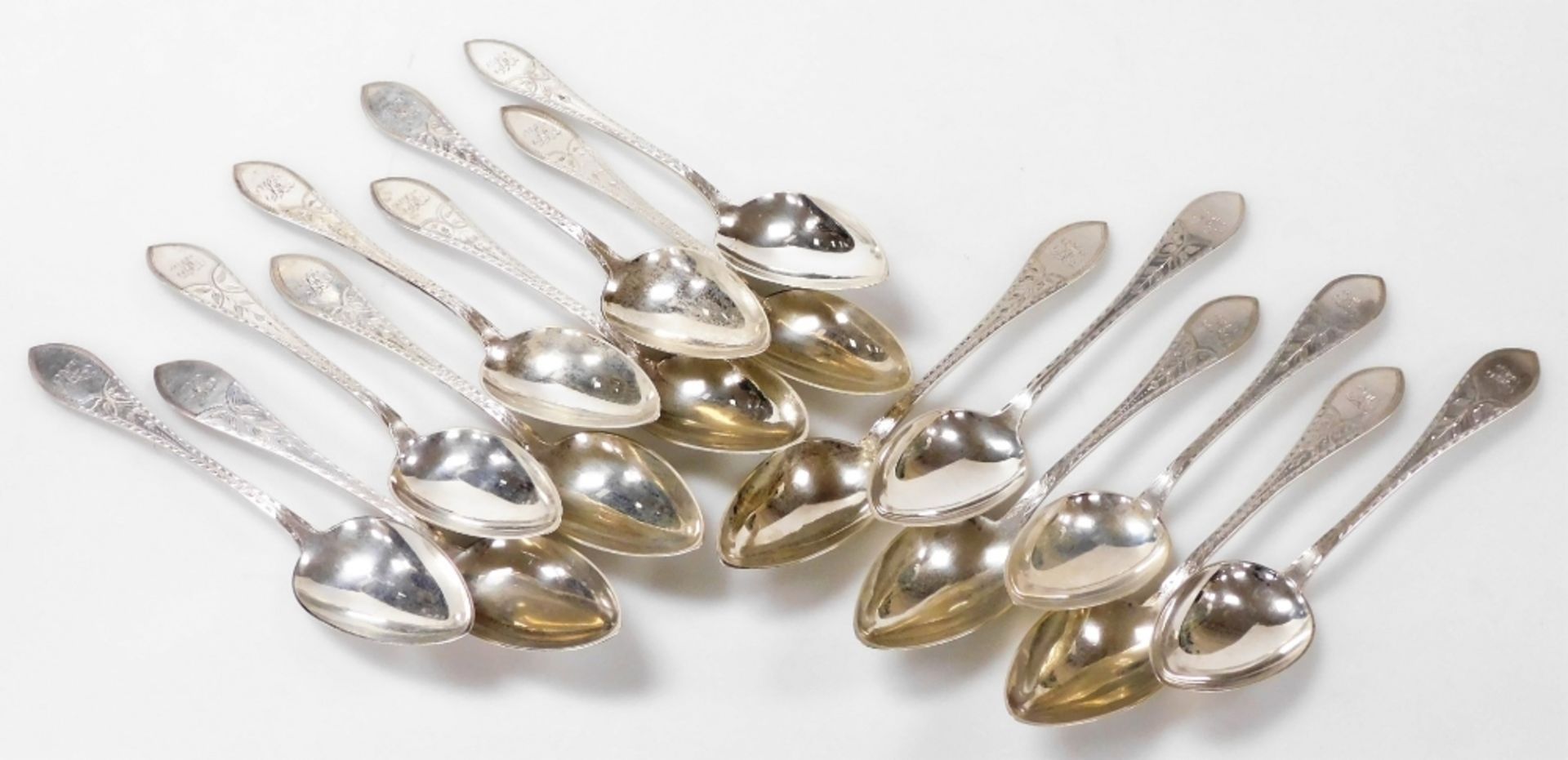 A set of fifteen Meyer Danish silver table spoons, foliate engraved, shield reserve monogram engrave