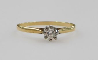 A diamond solitaire ring, in a high claw setting, in yellow metal stamped 18ct, approximately 0.25ct