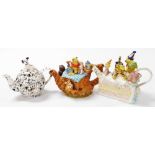 Three Disney pottery teapots, comprising Disney Showcase Collection Winnie The Pooh birthday cake, l