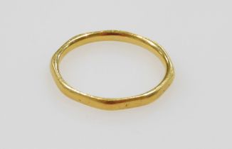 A 22ct gold wedding band, of octagonal form, size M/N, 2.2g.