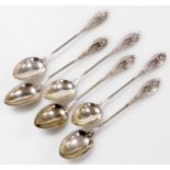 A set of six Norwegian silver coffee spoons, each handle embossed with irises and lily of the valley