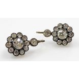 A pair of Victorian diamond drop earrings, of floral form, set in white and yellow metal, with fish
