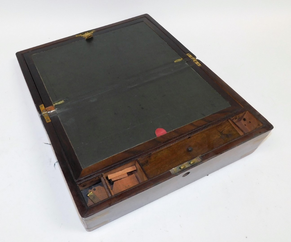 A Victorian walnut and brass bound writing slope, the hinged lid opening to reveal a slope and fitte - Image 4 of 5