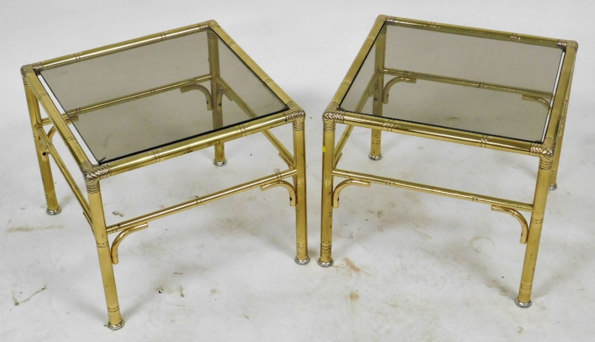 A late 20thC brass nest of occasional tables, inset with smoky glass, comprising a rectangular table - Image 2 of 4