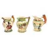 Three Crown Devon Fieldings pottery jugs, comprising Widdicombe Fair musical jug, RD NO 802897, 19cm