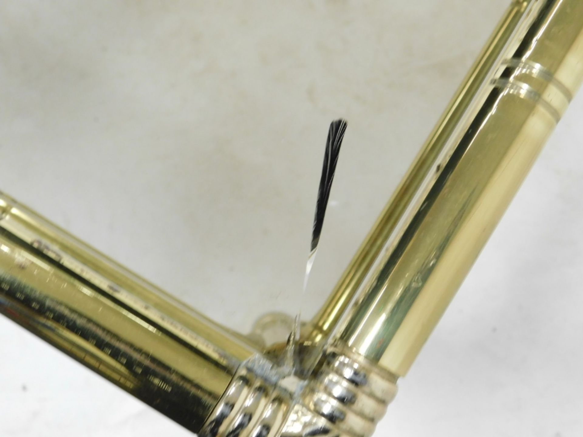 A late 20thC brass nest of occasional tables, inset with smoky glass, comprising a rectangular table - Image 4 of 4