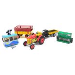 A group of tinplate toys, comprising a Zetor tractor and trailer, Pavok plough, clockwork cable car,