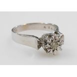 An 18ct white gold and diamond solitaire ring, high claw illusion set, size L, 4.6g.