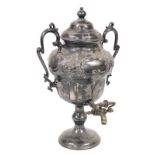 A Victorian silver plated tea urn and cover, of twin handled ogee baluster form, embossed with flowe