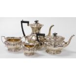 An Edward VII silver four piece tea and coffee set, of fluted form, presentation engraved 'presented