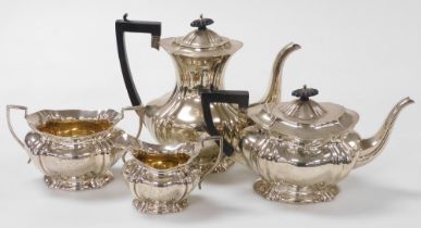 An Edward VII silver four piece tea and coffee set, of fluted form, presentation engraved 'presented
