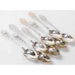 A set of eight Meyer Danish silver dessert spoons, foliate engraved, shield reserve monogram engrave