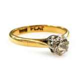 An 18ct gold platinum and diamond solitaire ring, high claw set, approx 0.6ct, size L, 2.8g.
