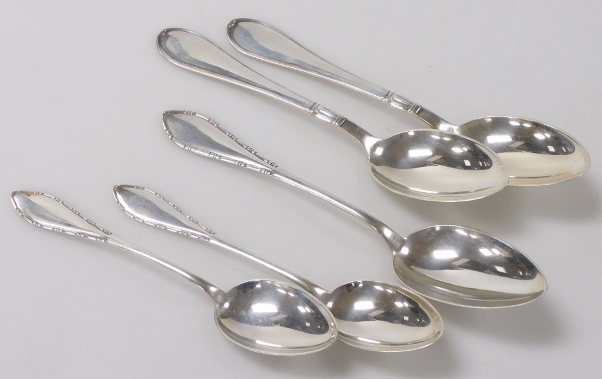 A pair of Danish silver tablespoons, together with a set of three Meyer spoons with a beaded and loz